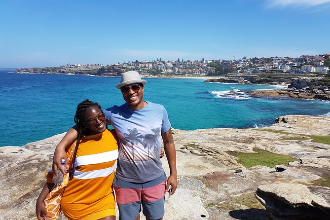 Bondi Beach Walking Tour with Optional Bondi to Bronte Coastal Walk - Aboriginal rock art beside a famous beach