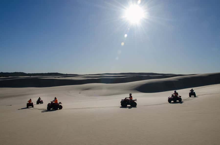 Port Stephens: Worimi Sand Dune Quad Bike Adventure - Climbing 12 to 30-meter walls of sand