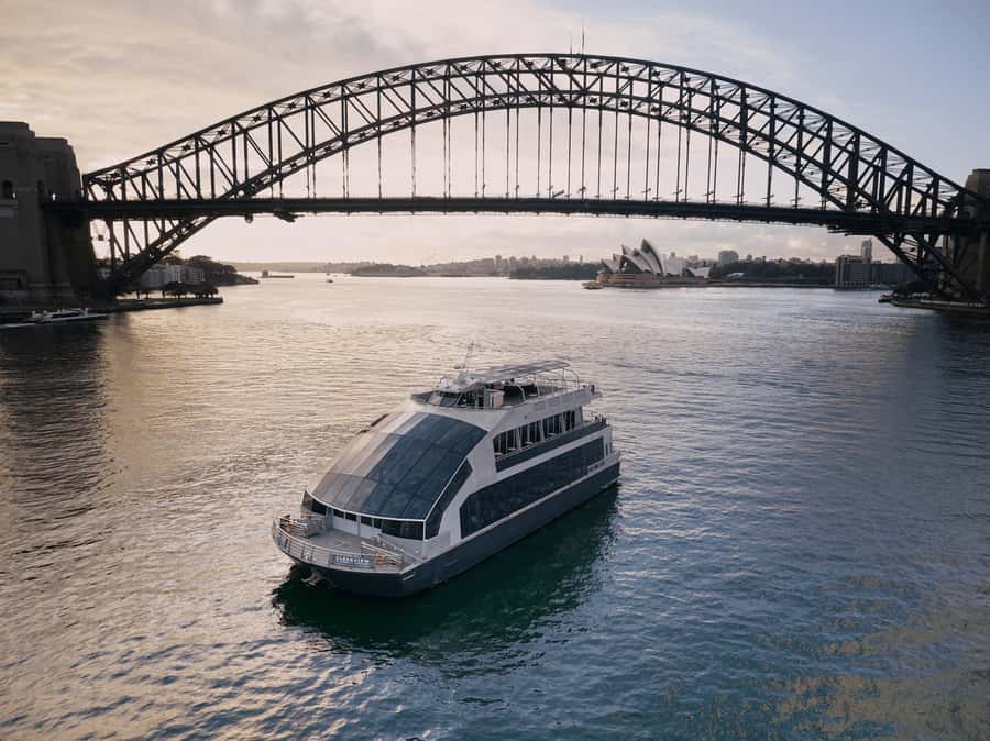 Sydney Harbour Lunch Cruise: 360° Glass Boat Views & Buffet - The Harbour Bridge from the water